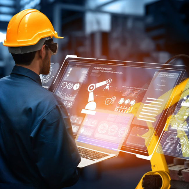 worker-controlling-the-robot-through-a-computer